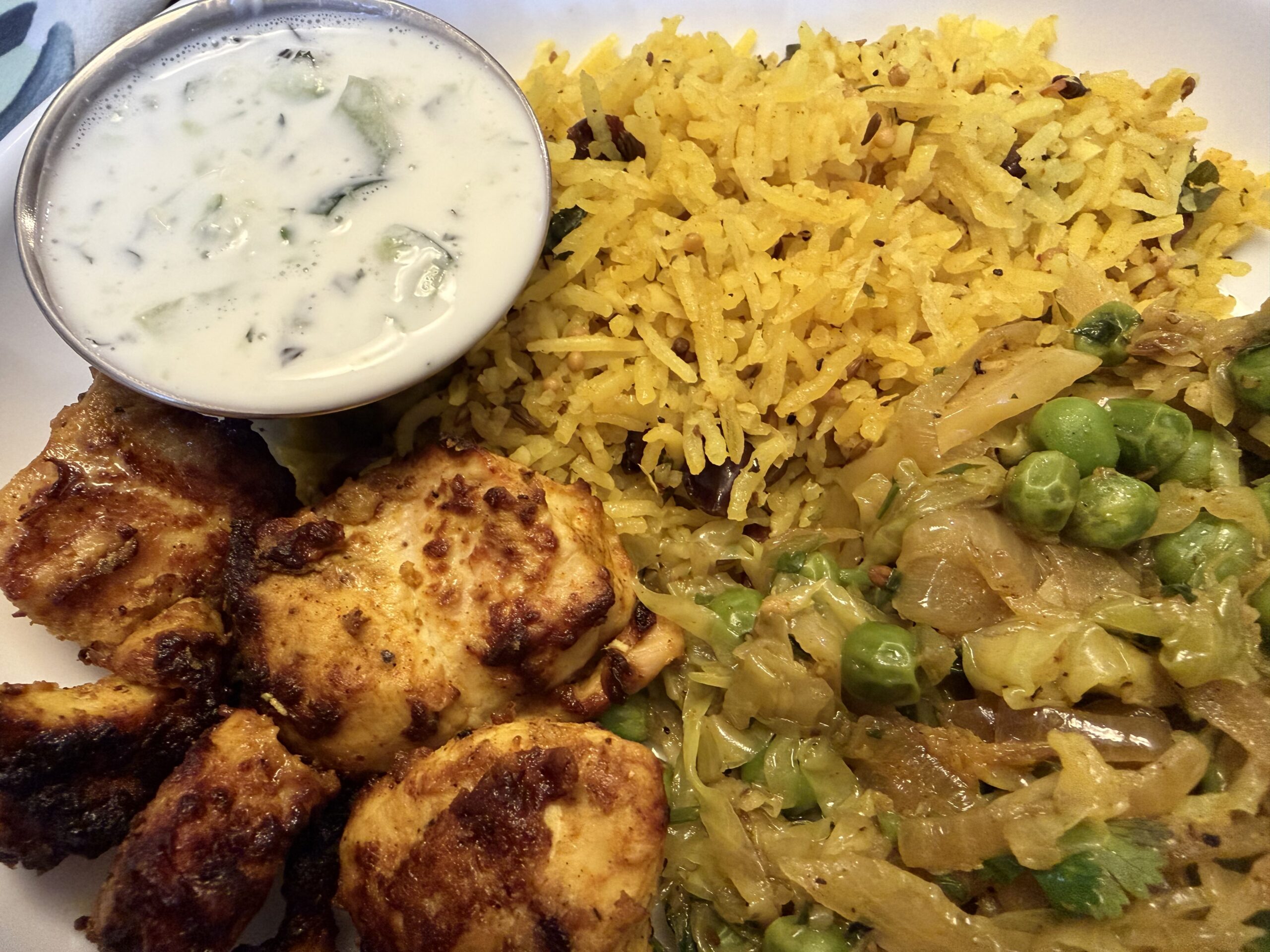 South Indian Feast: Tandoori Chicken, Lemon Rice, and Stir-Fried Cabbage, Onion, and Peas
